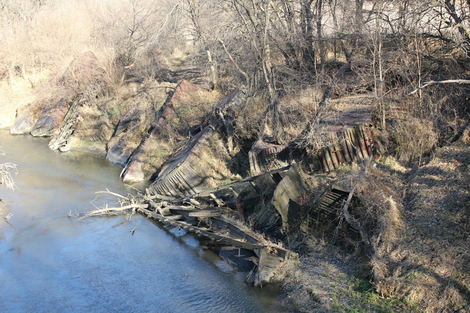 Scrap boxcars used to stabilize creek bank